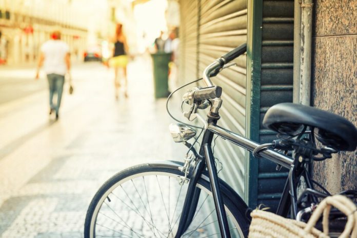 bicycle-parked-on-the-european-street-close-up-portugal_266732-24884