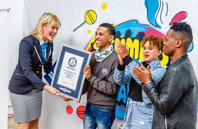 adjudicator-Sofia-presenting-Enrico-with-a-Guinness-world-Records