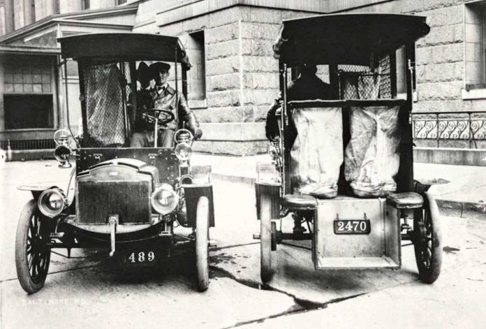 Two-Columbia-Mark-mail-trucks-face-in-opposite-directions