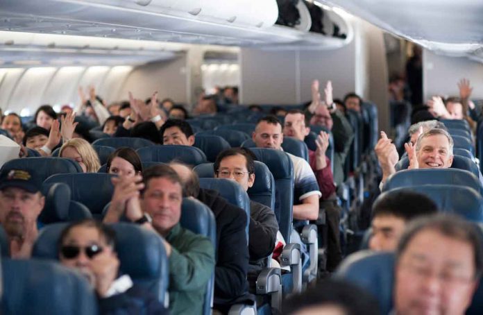 Passengers_aboard_a_Delta_Air_Lines_flight