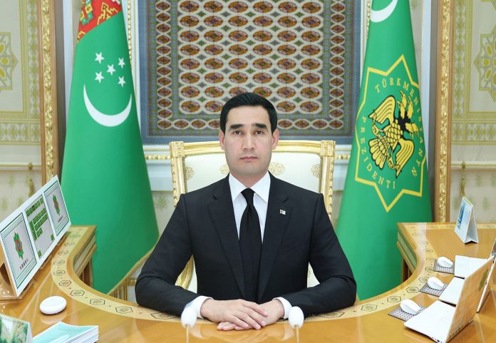 км